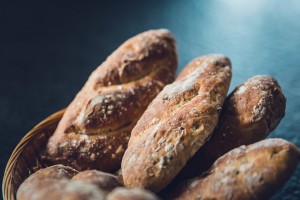 fresh-bread-with-banana-and-walnut-loaf-in-basket-homemade-buns