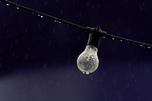 light-bulb-in-rain-during-a-stormy-night-shining-in-the-rain-in-the-rainy-season