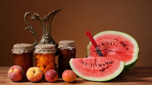 still life with peaches watermelon fruit jam on old wooden table, vintage tone